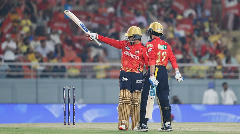 Punjab Kings Priyansh Arya, left, celebrates after scoring fifty runs. AP