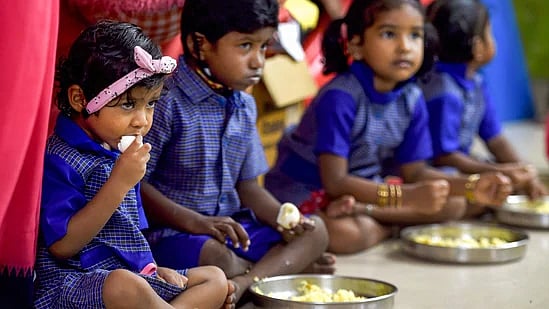 PTI : School children having mid-day meal under ICDS programme