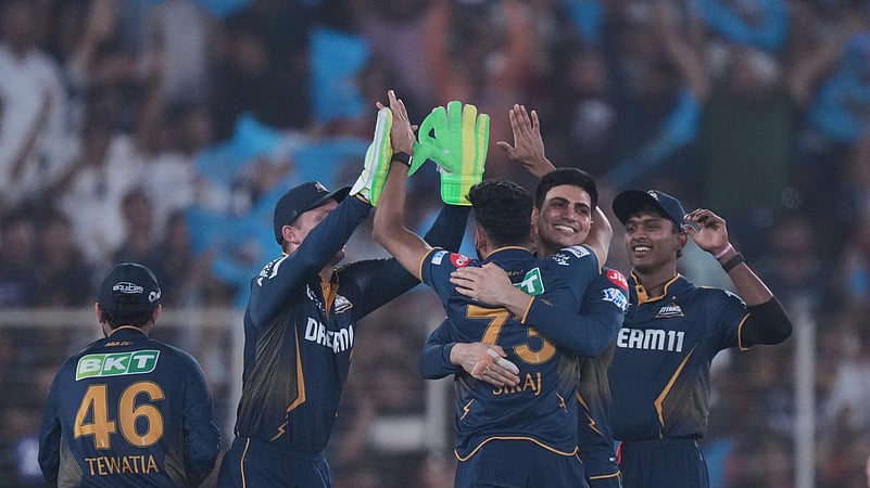Gujarat Titans Mohammed Siraj and teammates celebrate the wicket. AP