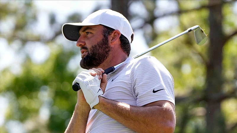 Scottie Scheffler watches his tee shot on the sixth hole. AP