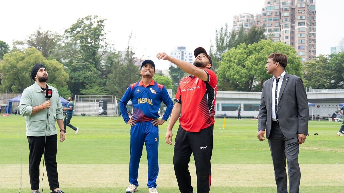 Photo: X | CAN : Nepal captain Rohit Paudel with Hong Kong captain during the toss.