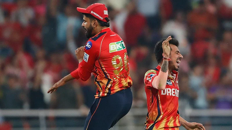Punjab Kings captain Shreyas Iyer, left, and Yuzvendra Chahal celebrate