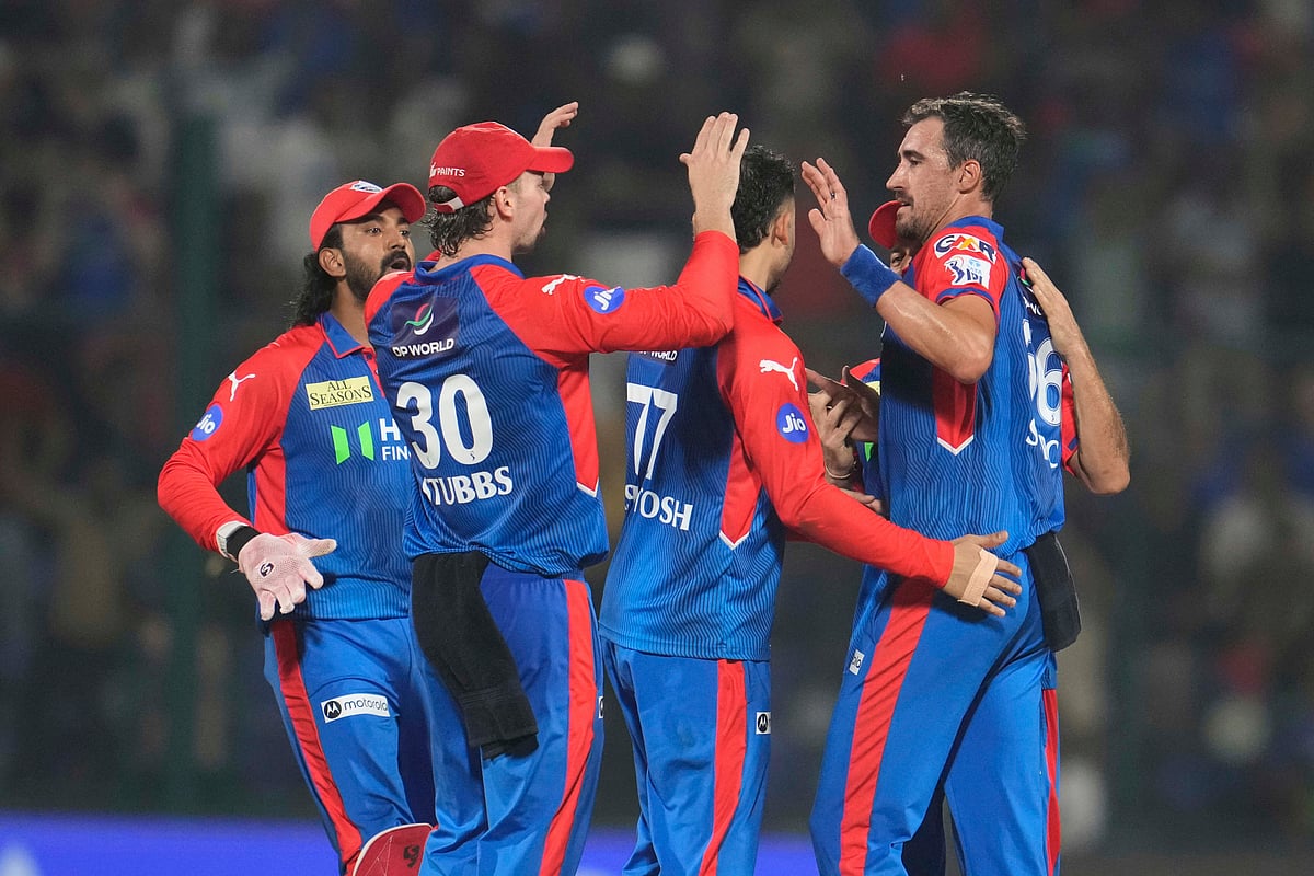 Delhi Capitals' Mitchell Starc, right, celebrates with teammates after the dismissal of Rajasthan Royals' Dhruv Jurel during the Indian Premier League cricket match between Delhi Capitals and Rajasthan Royals at Arun Jaitley Stadium in New Delhi, India, Wednesday, April 16, 2025. 


 - (AP Photo/Manish Swarup)