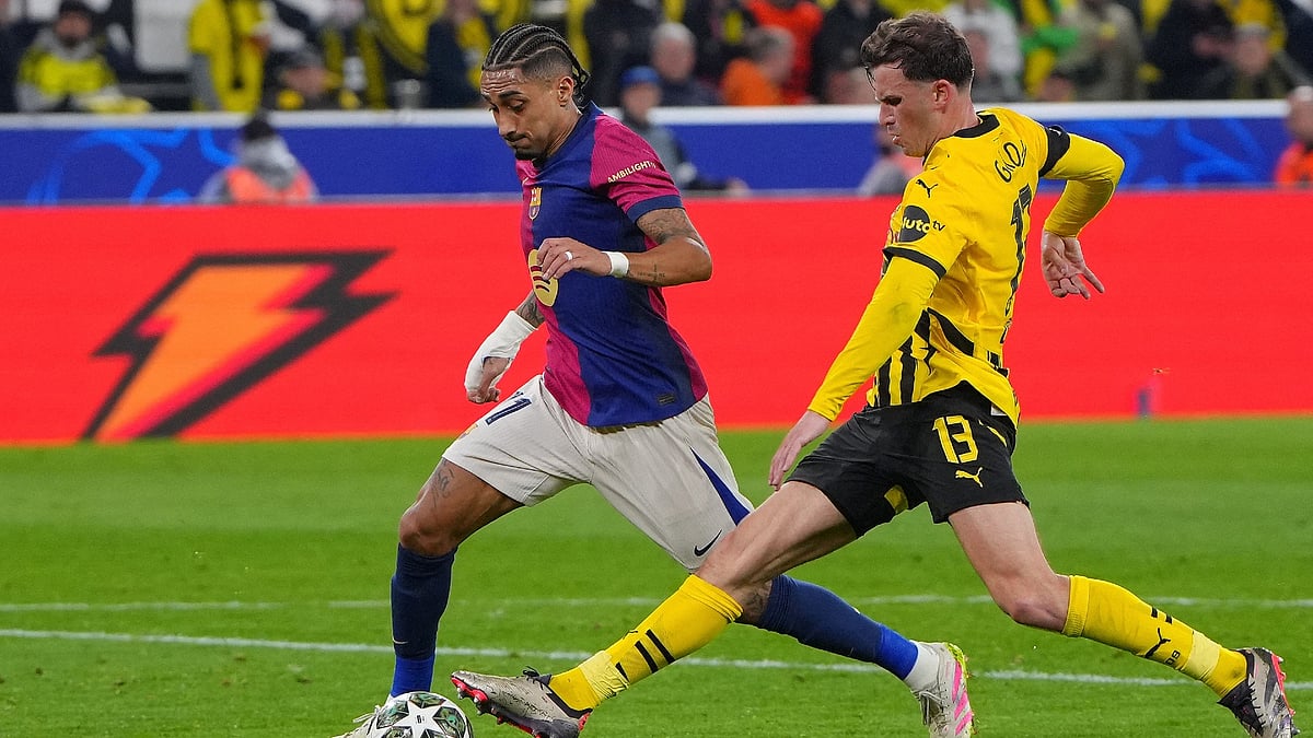 Borussia Dortmund's Pascal Gross in action against Barcelona's Raphinha.