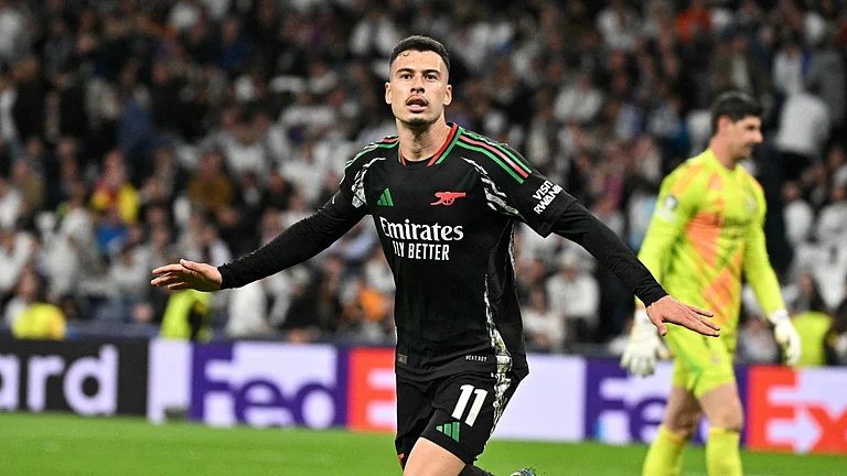 Gabriel Martinelli celebrates his late goal in Madrid - null