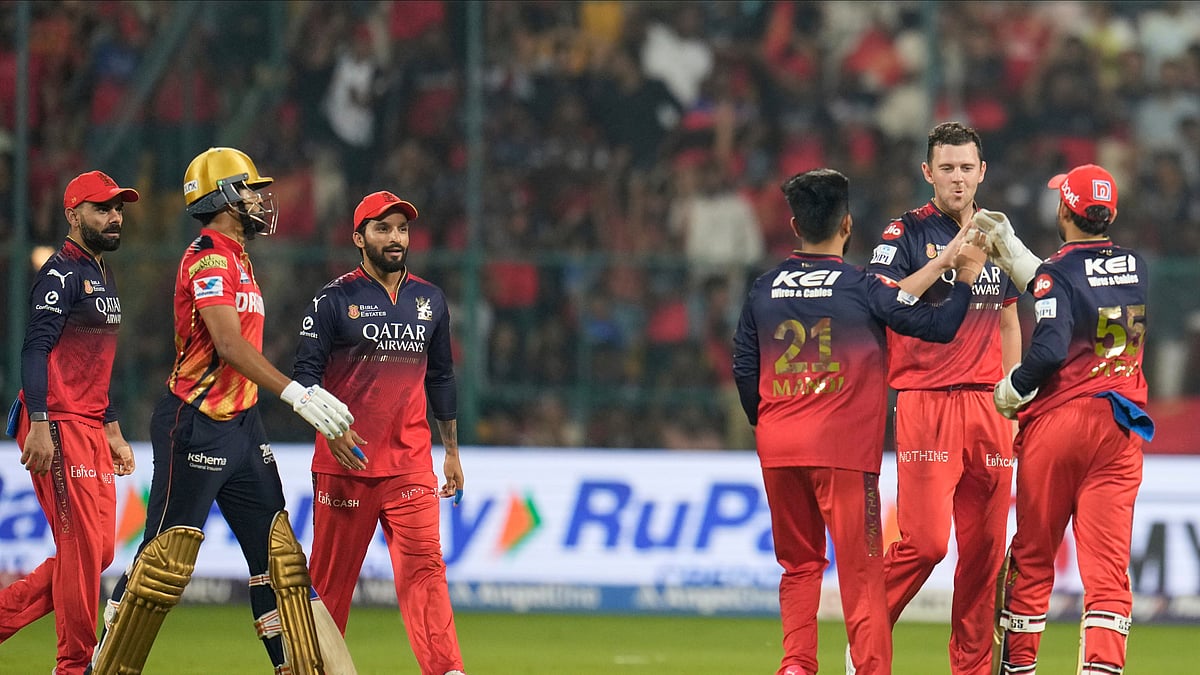 Royal Challengers Bengalurus Josh Hazlewood, second right, celebrates. AP