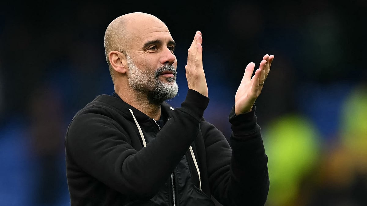 Pep Guardiola applauds the fans at Goodison Park for the final time. - File