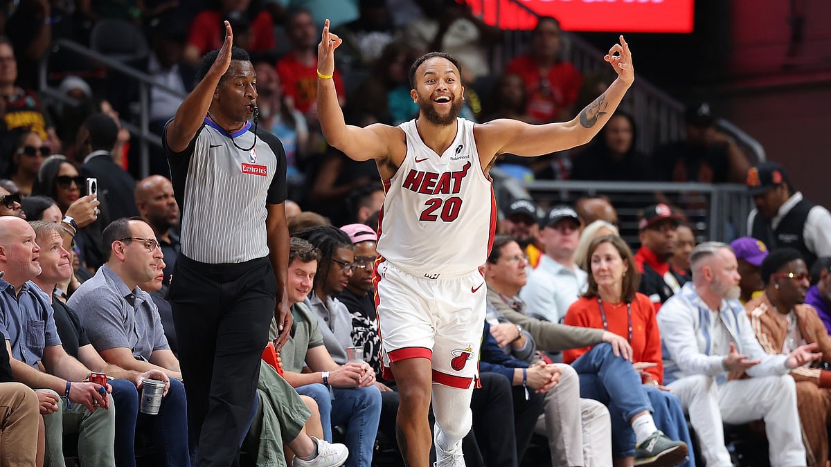 Kyle Anderson #20 of the Miami Heat reacts after a three-point basket against the Atlanta Hawks during the third quarter of an NBA play-in tournament game on April 18, 2025 in Atlanta, Georgia.