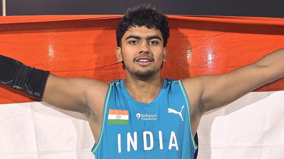 X | SAI Media  : Himanshu Jakhar with Indian flag at the U-18 Asian Athletics Championships 2025. 