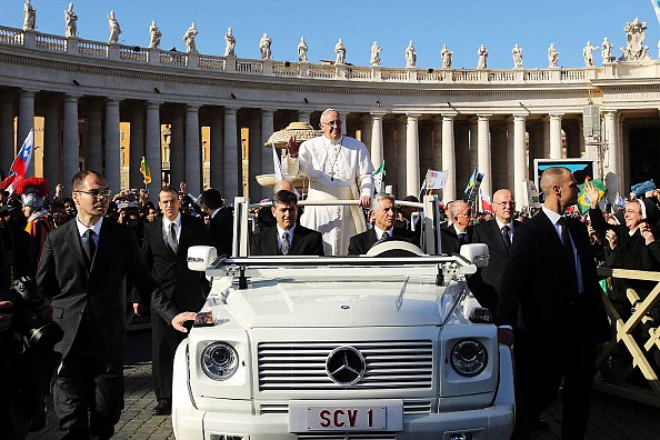 Pope Francis drives through the crowds