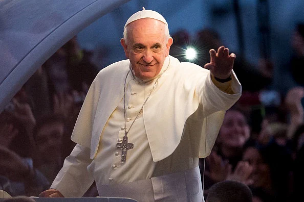 Pope Francis waves from the Popemobile
