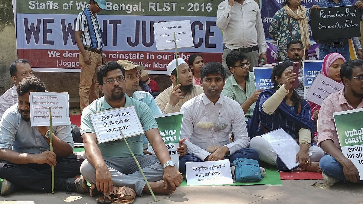 West Bengal teachers protest demanding clarity on the tainted-untainted list. - PTI