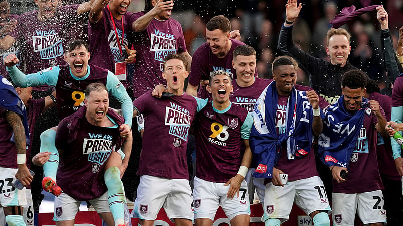 Burnley players celebrate their promotion to the English Premier League. AP