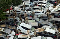 Earth Day 2025: Global Warming Is A Security Threat, Armies Must Adapt, Say Experts AFP : Soldiers search wrecked cars after flooding in Valencia, Spain, on November 8, 2024