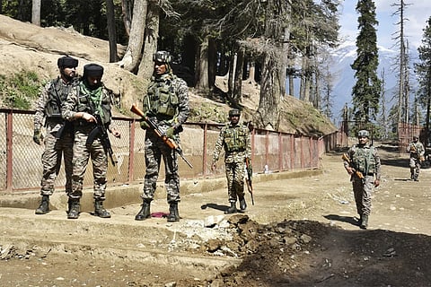 Heavily armed guards border the perimeter of the spot