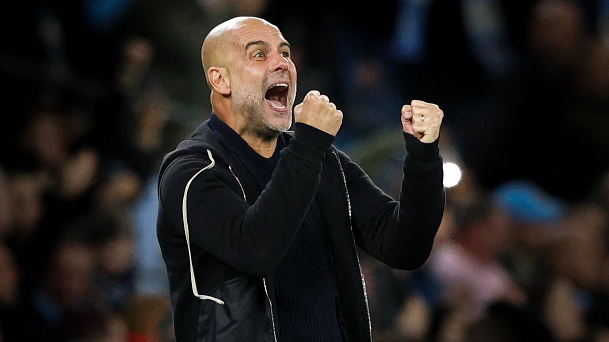 Pep Guardiola celebrates Man City's win over Aston Villa