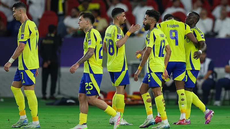 Al-Nassr celebrate their third goal.