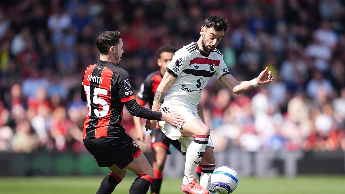 Manchester United's Bruno Fernandes (right) and Bournemouth's Adam Smith battle for the ball during the English Premier League soccer match between Bournemouth and Manchester United at Vitality Stadium, Bournemouth, England, Sunday, April 27, 2025. 

