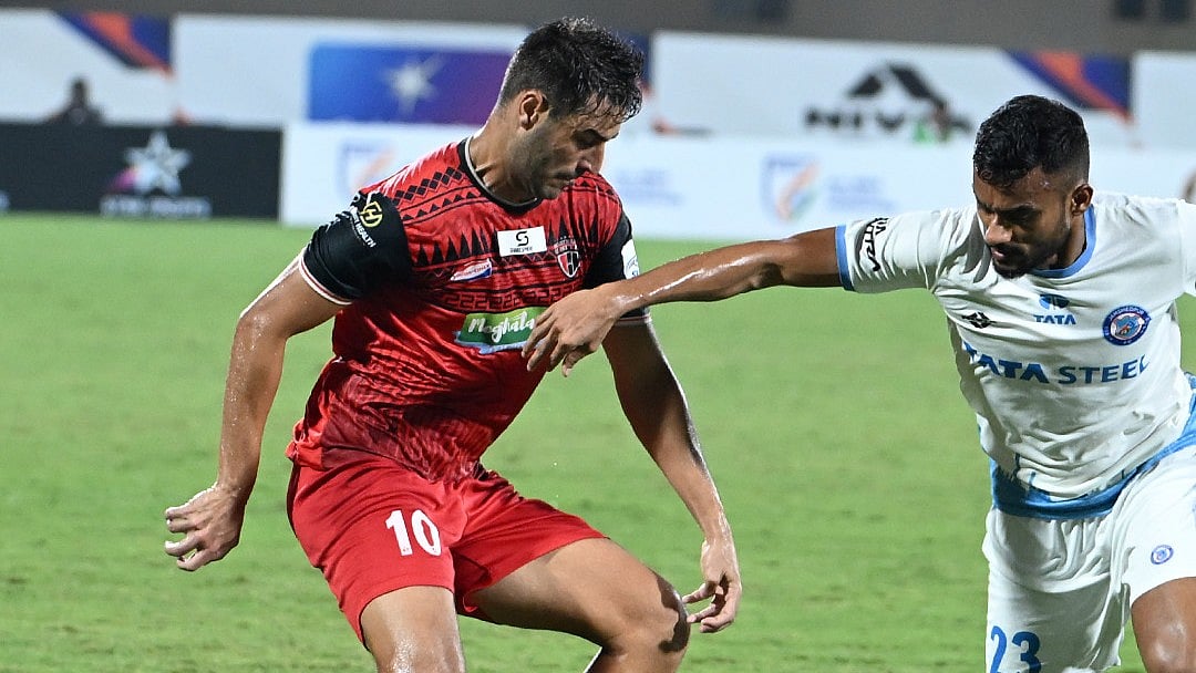 | Photo: X / NEUtdFC : NorthEast United's Nestor Albiach plays against Jamshedpur FC's Mohammed Uvais in the Kalinga Super Cup 2025.
