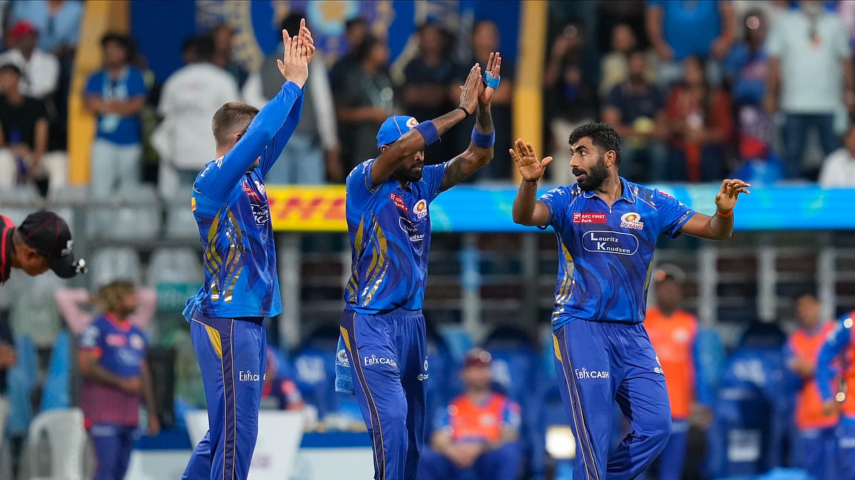 AP Photo/Rajanish Kakade : Mumbai Indians' Jasprit Bumrah, right, celebrates the dismissal of Lucknow Super Giants' David Miller during the Indian Premier League cricket match at Wankhede Stadium in Mumbai.