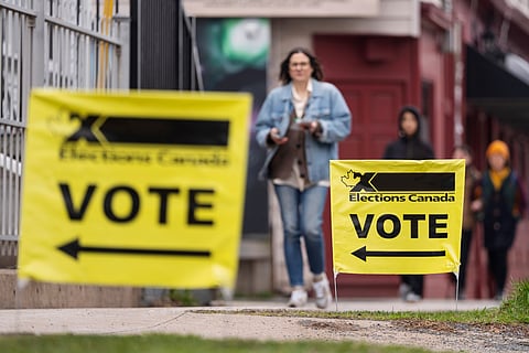 Elections Canada signage is seen as voters arrive at a polling station on Election Day in Halifax, Canada, Monday, April 28, 2025.