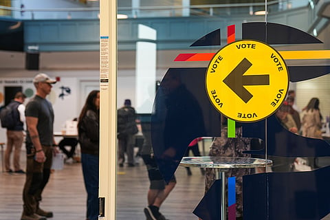People queue up to cast their votes across Canada.