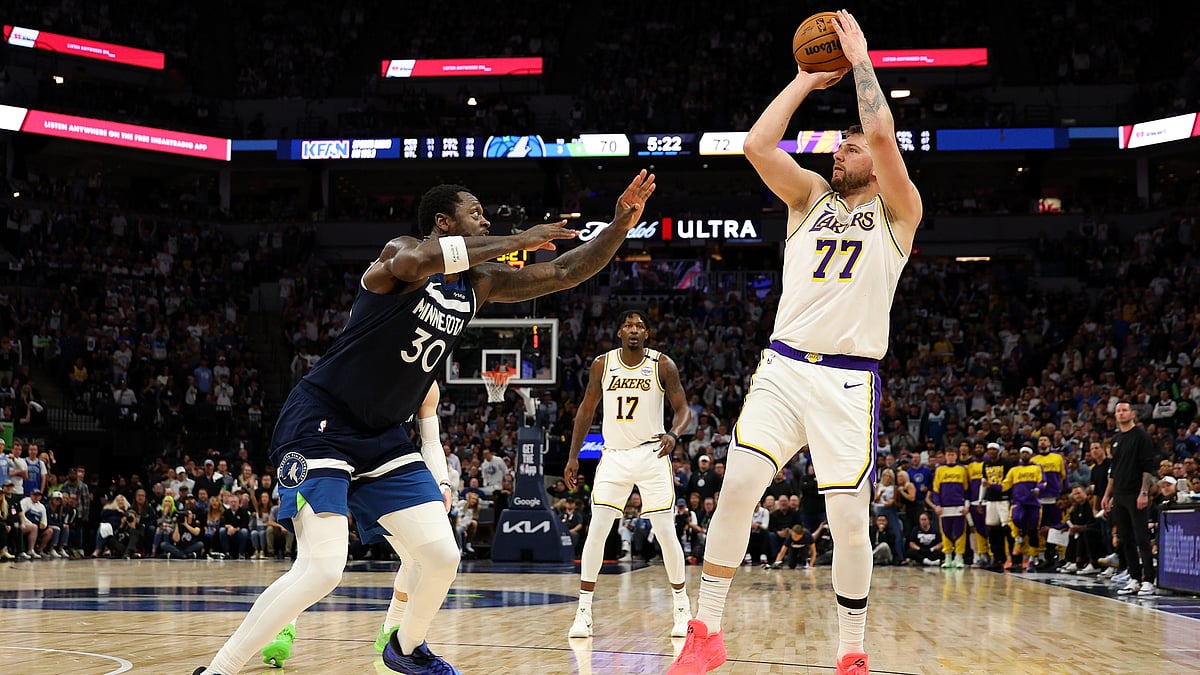 File : Luka Doncic shoots against the Minnesota Timberwolves in Game 4.