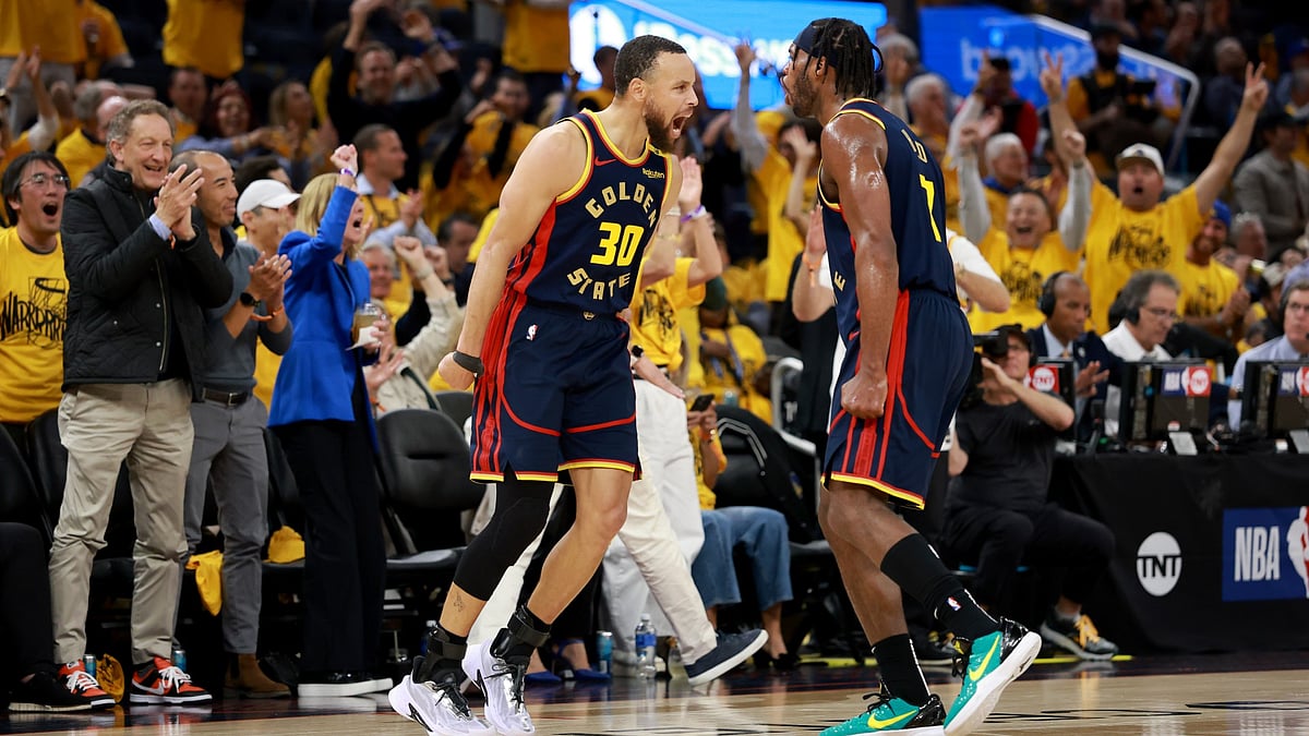 Stephen Curry (left) and Buddy Hield celebrate during the Golden State Warriors' Game 4 win over the Houston Rockets in the NBA Playoffs.