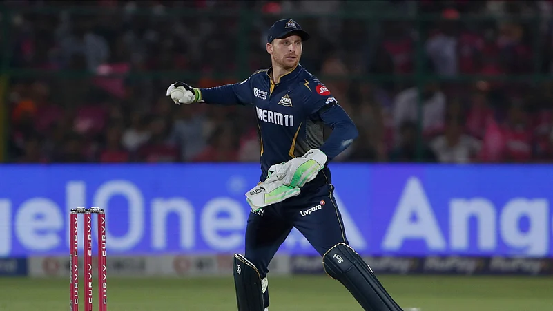 Gujarat Titans wicketkeeper Jos Butler fields the ball. AP