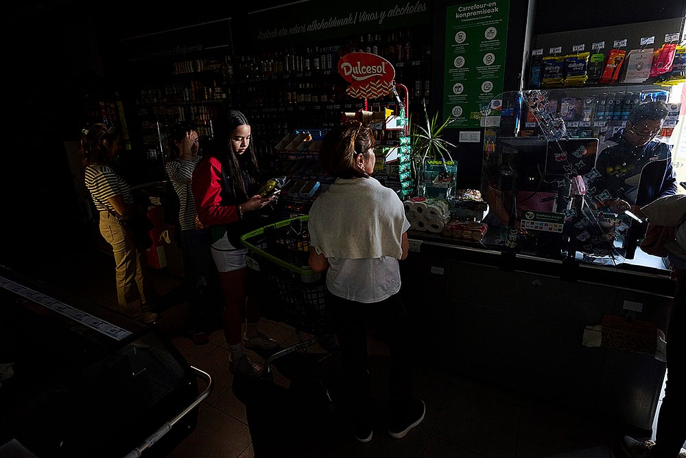 Spain Power Outage People buy food at a supermarket