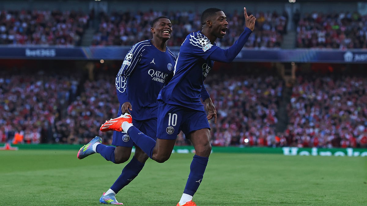 Ousmane Dembele celebrates after finding the net at the Emirates Stadium - null