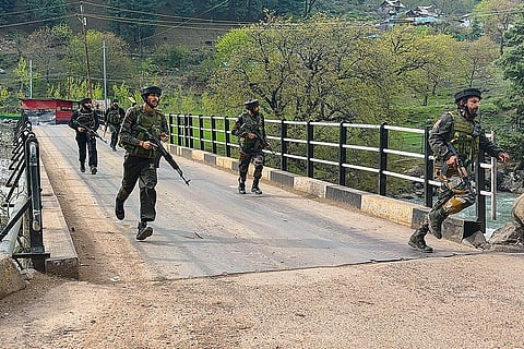Security personnel rush to the spot after terrorists attacked a group of tourists at Baisaran