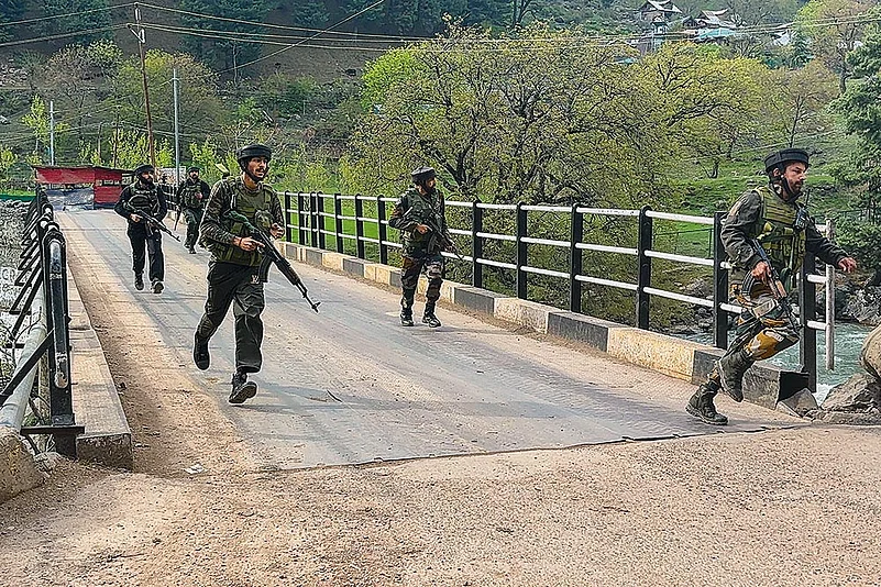 Security personnel rush to the spot after terrorists attacked a group of tourists at Baisaran