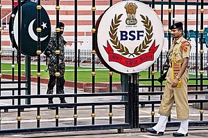 | Photo: PTI : Too Close for Comfort: Border Security Force soldiers and Pakistani Rangers stand guard at Attari-Wagah border