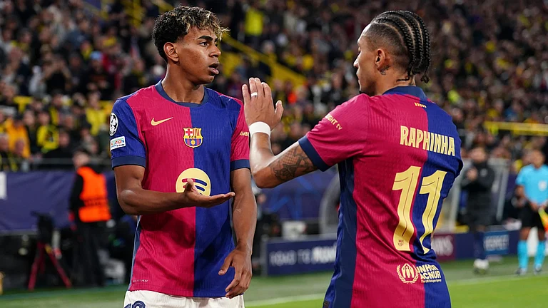 Barcelona's Lamine Yamal and Raphinha are expected to play decisive roles in their Champions League semi-final tie against Inter Milan. - null