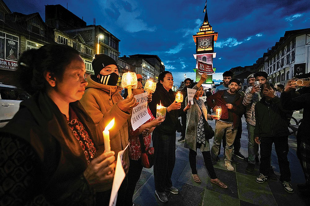 | Photo: AP : In Solidarity: People gather for a candle march in Srinagar 