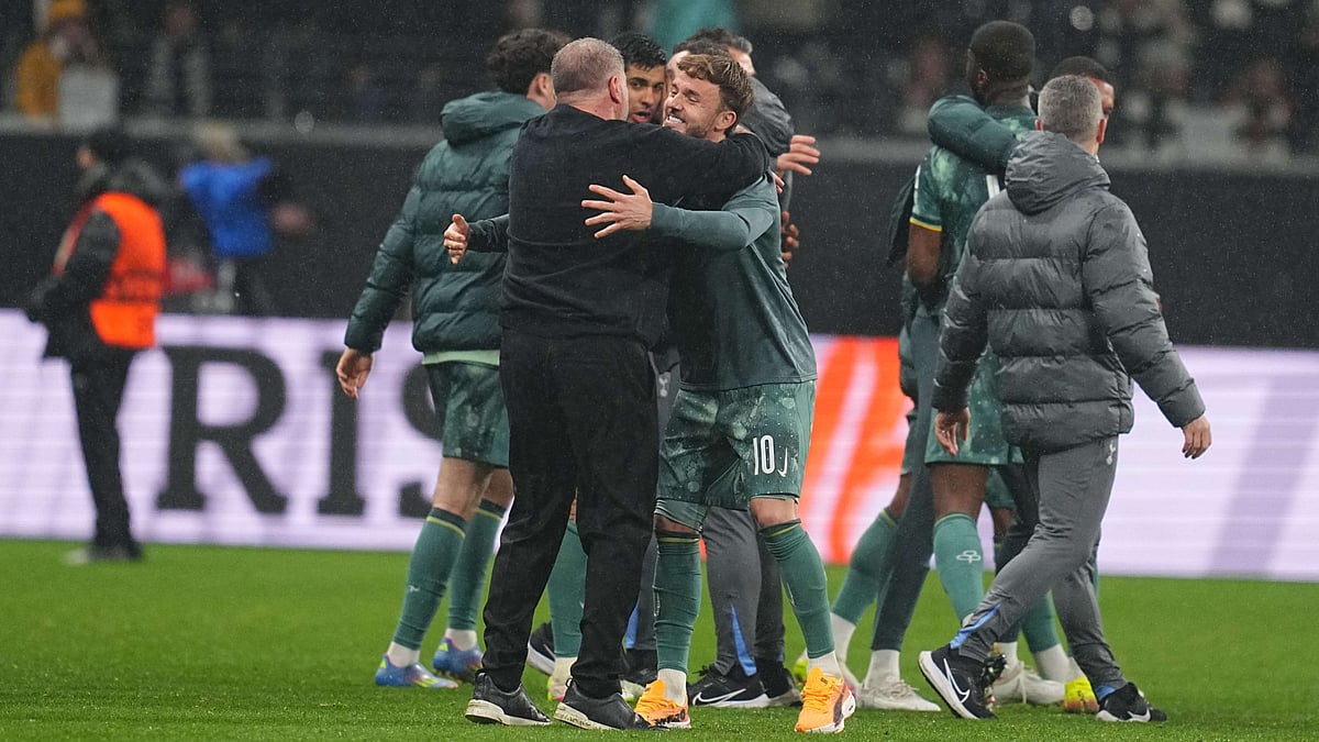 Tottenham Hotspur's Ange Postecoglou and James Maddison - null