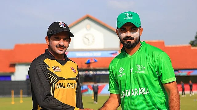 X/malaysiacricket : Saudi Arabia captain Waji Ul Hassan with Malaysia skipper Syed Aziz Mubarak