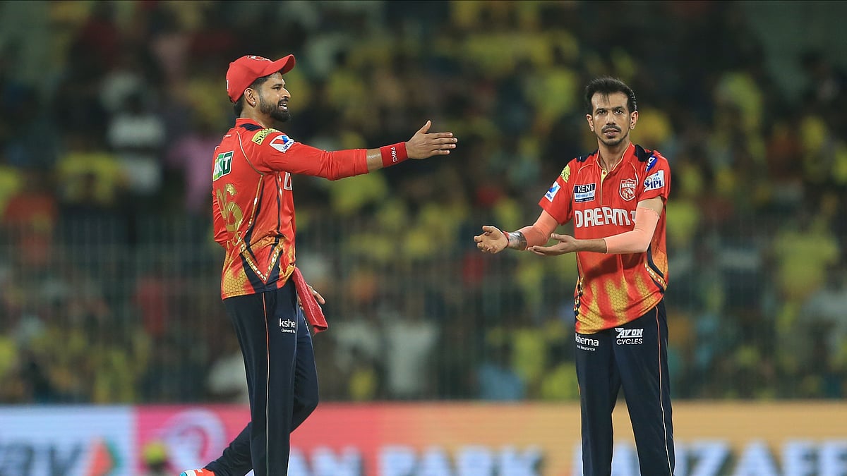 Punjab Kings Yuzvendra Chahal, right, celebrates the dismissal. AP