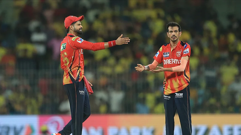 Punjab Kings Yuzvendra Chahal, right, celebrates the dismissal. AP