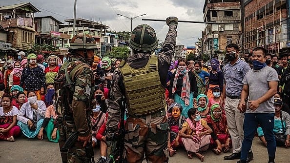 Getty Images : Army personnel stand guard as demonstrators protest against mass burial of Kuki-Zomi people killed in Manipur's ethnic violence, in Imphal on August 3, 2023. | Representational Image
