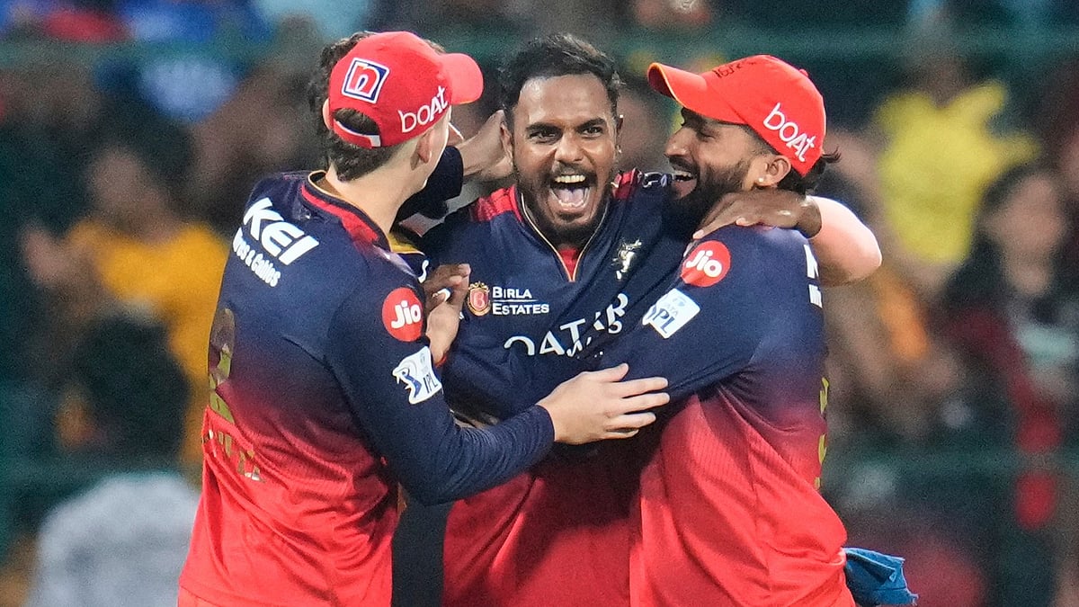 Royal Challengers Bengalurus Yash Dayal, centre, celebrates. AP