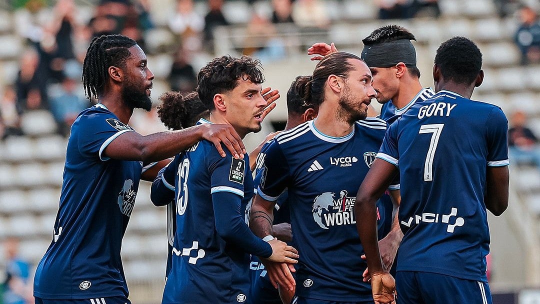 Paris FC players celebrate during a Ligue 2 match.