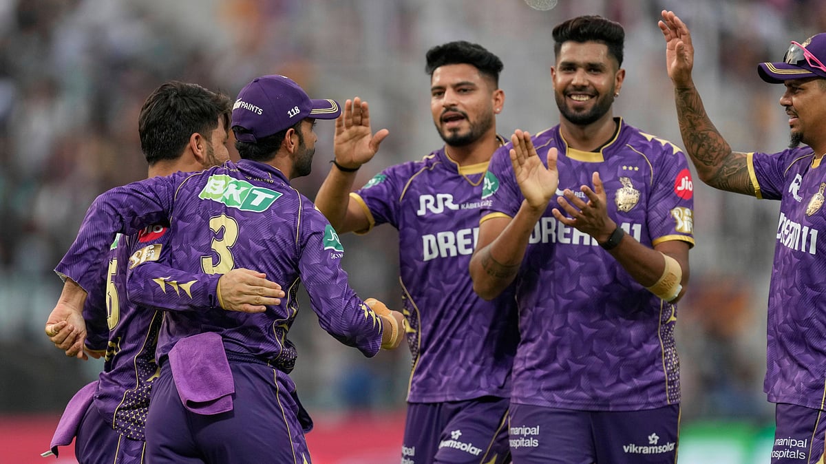 AP Photo/Bikas Das : Kolkata Knight Riders' captain Ajinkya Rahane, left, celebrates with teammates after taking the catch to dismiss Rajasthan Royals' Vaibhav Suryavanshi bowled by Vaibhav Arora, second from right, during the Indian Premier League cricket match in Kolkata.