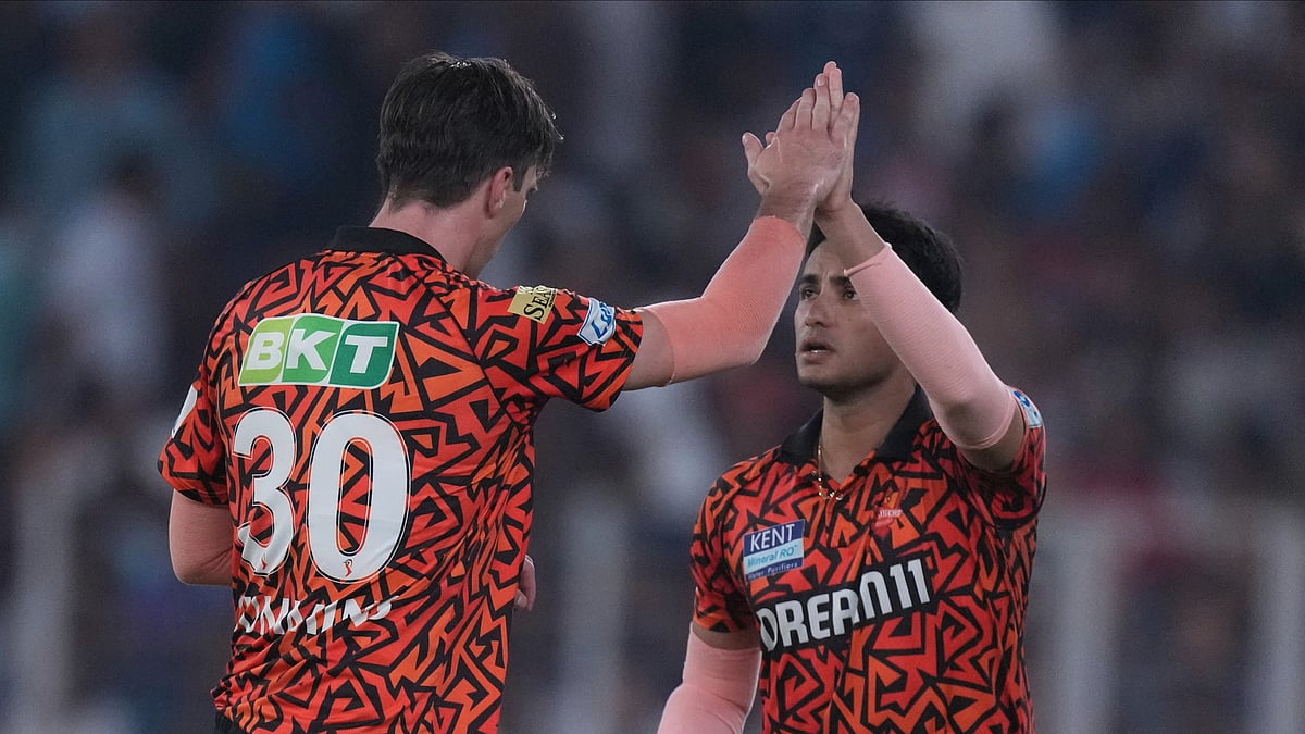 Sunrisers Hyderabads captain Pat Cummins, left. AP Photo