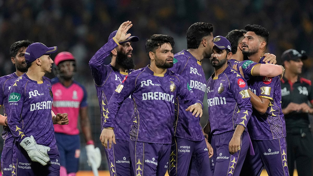 Kolkata Knight Riders players celebrate after winning the IPL match. AP