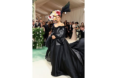 Zendaya's floral headpiece and black vintage gown by John Galliano, 2024