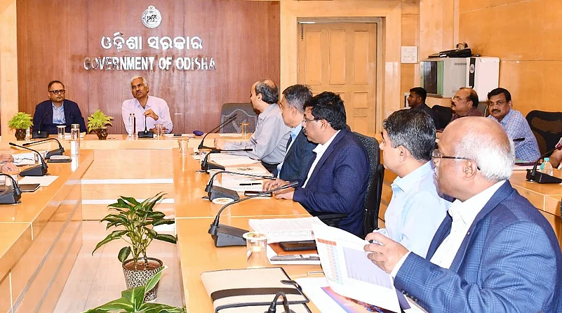 Chief Minister Shri Mohan Charan Majhi conducting a meeting in his office.