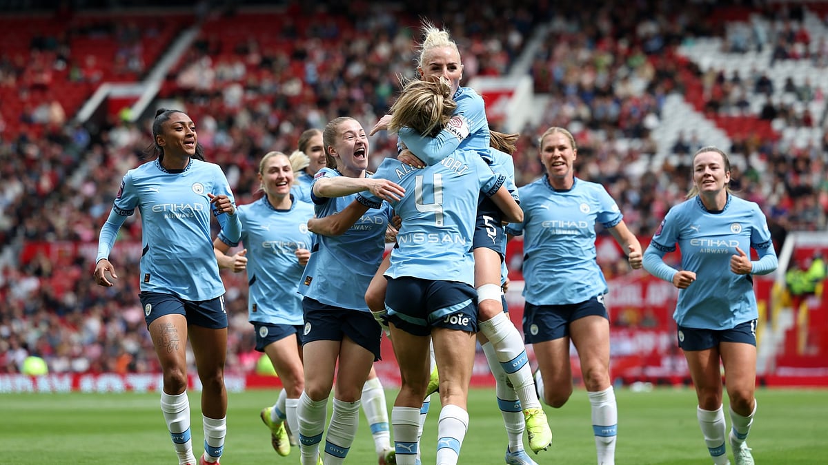 Manchester City players celebrating a win.