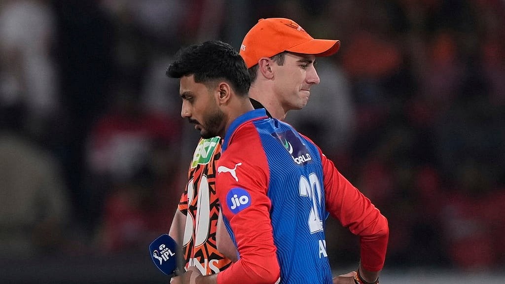 Sunrisers Hyderabads captain Pat Cummins shake hands with Delhi Capitals captain Axar Patel 